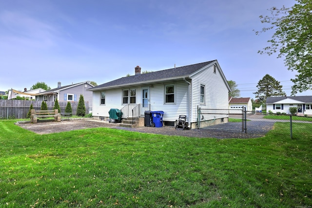 27 Aircraft Rd, West Haven, CT 06516 - back of property featuring a chimney and a patio