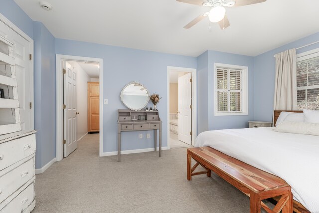 39 Wildemere Ave, Milford, CT 06460 - bedroom with baseboards, multiple windows, connected bathroom, and light colored carpet