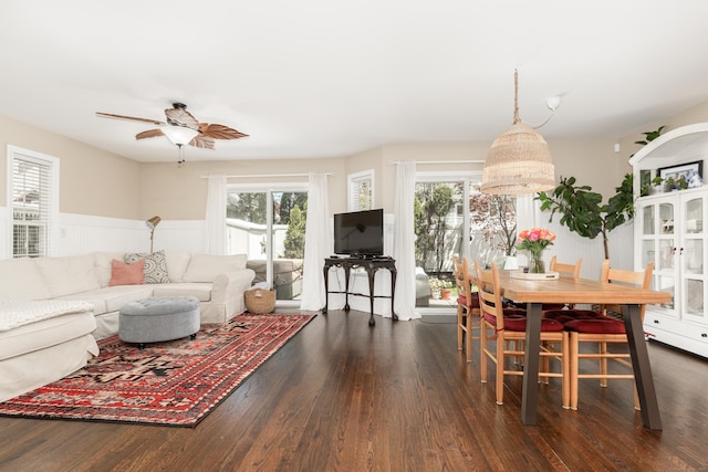 39 Wildemere Ave, Milford, CT 06460 - living area with dark wood-style flooring, ceiling fan, and a wainscoted wall