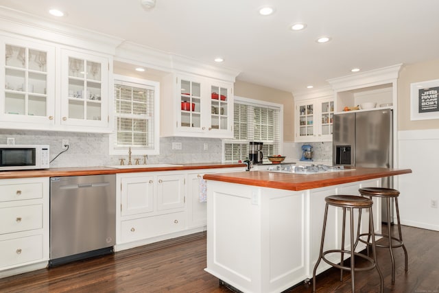39 Wildemere Ave, Milford, CT 06460 - kitchen with butcher block countertops, a sink, white cabinets, and stainless steel appliances
