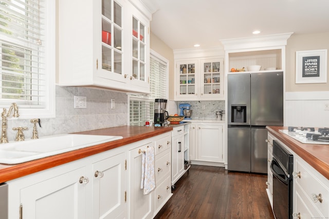 39 Wildemere Ave, Milford, CT 06460 - kitchen with black oven, a healthy amount of sunlight, white gas cooktop, stainless steel fridge with ice dispenser, and a sink