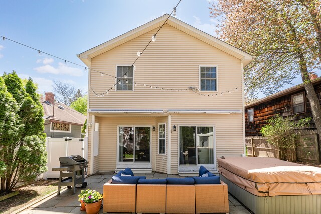 39 Wildemere Ave, Milford, CT 06460 - rear view of house featuring outdoor lounge area, a hot tub, a patio area, and fence
