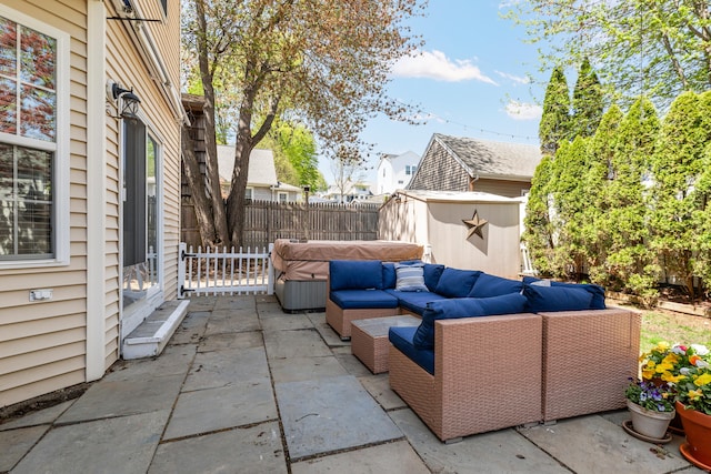 39 Wildemere Ave, Milford, CT 06460 - view of patio / terrace with an outdoor structure, outdoor lounge area, fence, a shed, and a hot tub