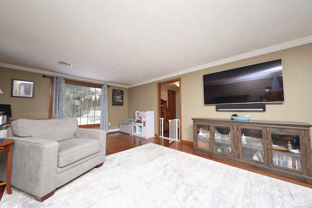 227 Hany Ln, Vernon, CT 06066 - living room with wood finished floors, ornamental molding, a baseboard heating unit, and baseboards
