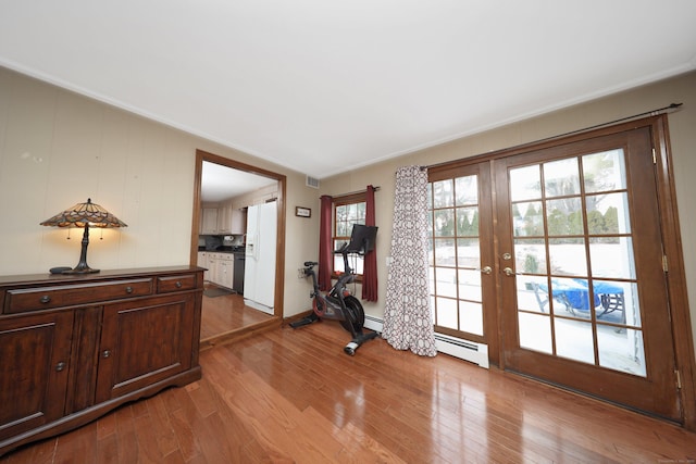 227 Hany Ln, Vernon, CT 06066 - doorway with french doors, light wood finished floors, and baseboard heating