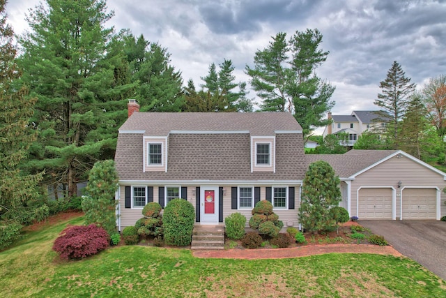 227 Hany Ln, Vernon, CT 06066 - colonial inspired home with a shingled roof, driveway, an attached garage, and a front lawn