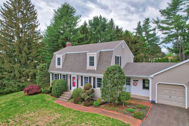 227 Hany Ln, Vernon, CT 06066 - colonial inspired home with a garage, a gambrel roof, a shingled roof, a front lawn, and a chimney