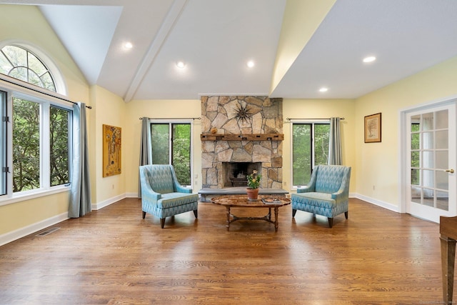 498 Eastbury Hill Rd, Glastonbury, CT 06033 - living area featuring healthy amount of natural light, a fireplace, lofted ceiling, baseboards, and wood finished floors