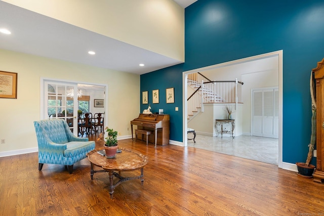 498 Eastbury Hill Rd, Glastonbury, CT 06033 - living area featuring stairs, wood finished floors, recessed lighting, baseboards, and a high ceiling