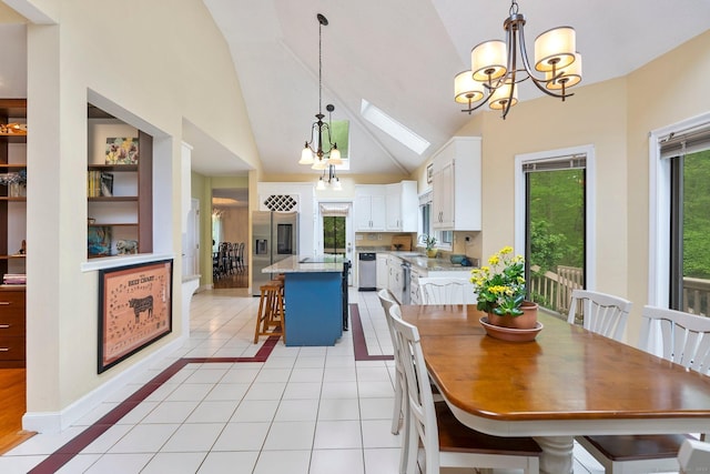 498 Eastbury Hill Rd, Glastonbury, CT 06033 - dining area with a chandelier, light tile patterned floors, a skylight, and high vaulted ceiling