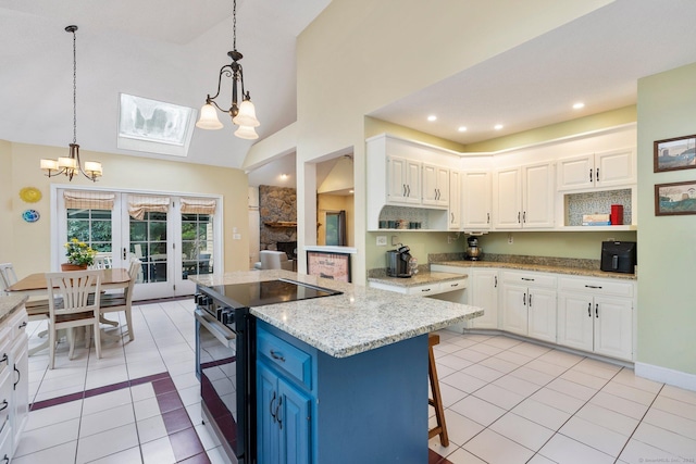 498 Eastbury Hill Rd, Glastonbury, CT 06033 - kitchen with open shelves, black range with electric cooktop, a chandelier, light tile patterned flooring, and high vaulted ceiling