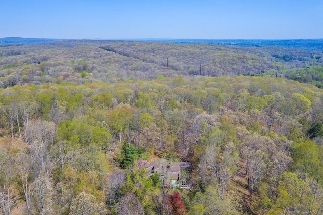 birds eye view of property with a wooded view