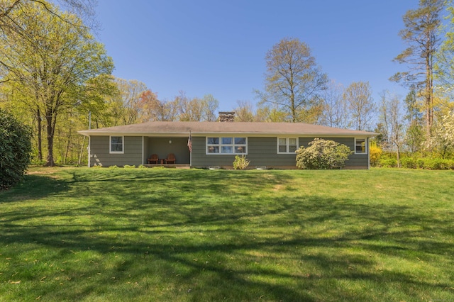 97 Doolittle Dr, Bethany, CT 06524 - rear view of property featuring a lawn and a chimney