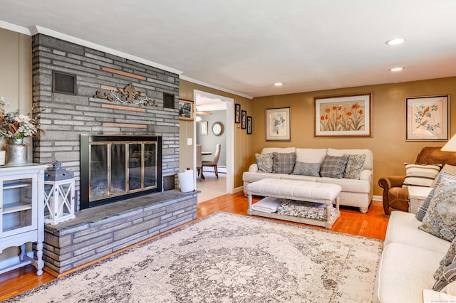 97 Doolittle Dr, Bethany, CT 06524 - living room featuring crown molding, baseboards, a stone fireplace, and wood finished floors