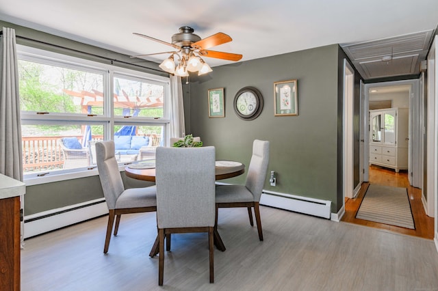 97 Doolittle Dr, Bethany, CT 06524 - dining room featuring a ceiling fan, wood finished floors, attic access, and a baseboard radiator