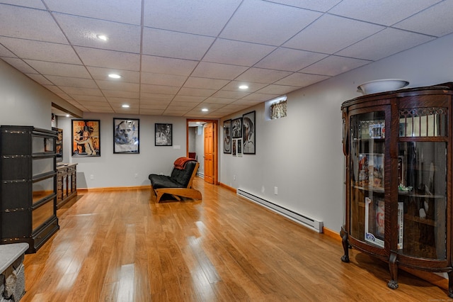 97 Doolittle Dr, Bethany, CT 06524 - sitting room featuring a paneled ceiling, baseboards, a baseboard radiator, recessed lighting, and light wood-style flooring