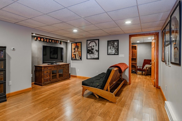 97 Doolittle Dr, Bethany, CT 06524 - living room with baseboard heating, baseboards, a drop ceiling, recessed lighting, and light wood-style flooring