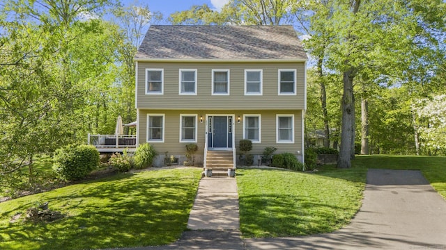 200 Sachem Head Rd, Guilford, CT 06437 - colonial home with a front lawn and a wooden deck