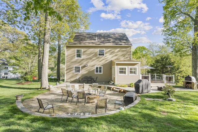 200 Sachem Head Rd, Guilford, CT 06437 - rear view of property featuring a patio, a wooden deck, and a lawn