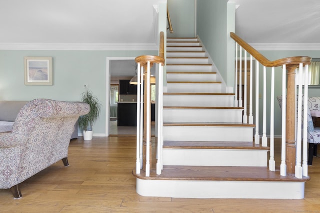200 Sachem Head Rd, Guilford, CT 06437 - stairs with wood finished floors, crown molding, and baseboards