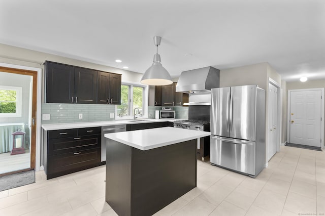 200 Sachem Head Rd, Guilford, CT 06437 - kitchen with appliances with stainless steel finishes, wall chimney range hood, a sink, backsplash, and light countertops