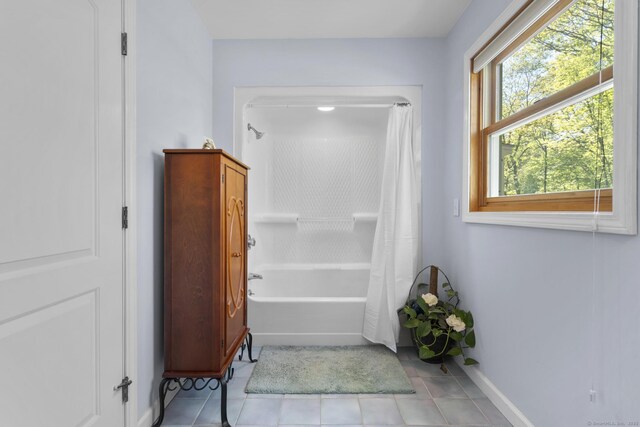 200 Sachem Head Rd, Guilford, CT 06437 - full bath with tile patterned floors, baseboards, and shower / bath combo with shower curtain