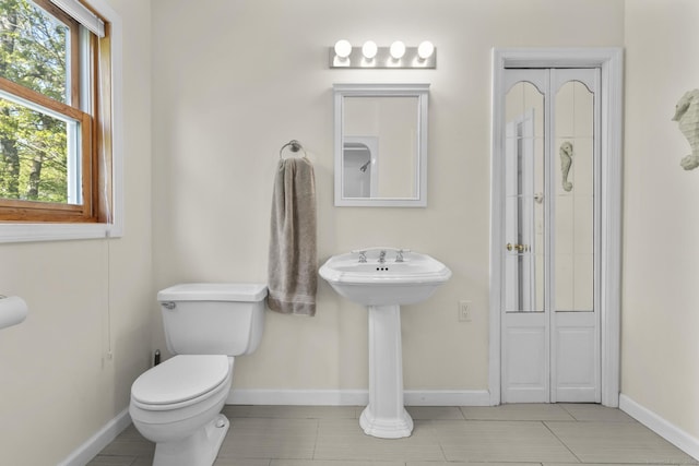 200 Sachem Head Rd, Guilford, CT 06437 - bathroom featuring toilet, baseboards, and tile patterned flooring