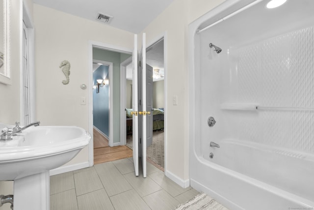 200 Sachem Head Rd, Guilford, CT 06437 - full bath featuring tub / shower combination, baseboards, and a sink