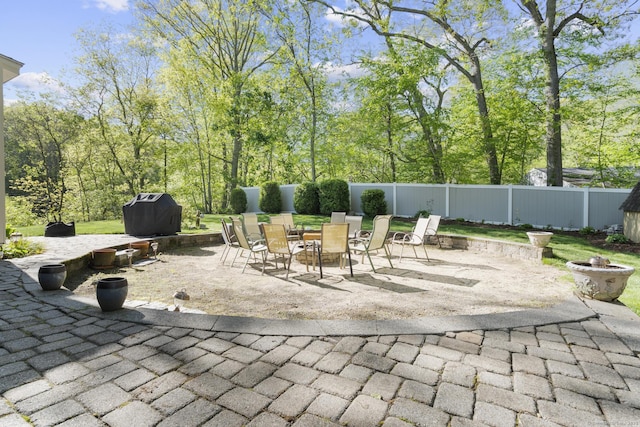 200 Sachem Head Rd, Guilford, CT 06437 - view of patio featuring an outdoor fire pit, a fenced backyard, and outdoor dining space