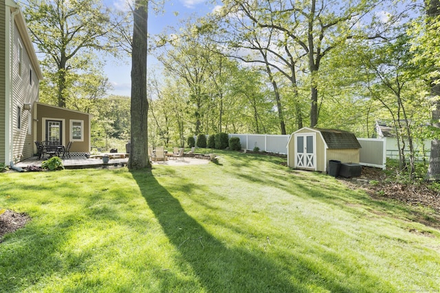 200 Sachem Head Rd, Guilford, CT 06437 - view of yard with a shed, a deck, an outdoor structure, and view of scattered trees