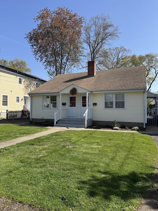 101 Forest Ave, Fairfield, CT 06824 - ranch-style home with a front yard and a chimney