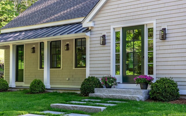24 Tompkins Hill Rd, Washington, CT 06793 - view of exterior entry featuring a standing seam roof, roof with shingles, and metal roof