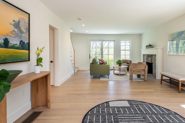 24 Tompkins Hill Rd, Washington, CT 06793 - living area featuring plenty of natural light, light wood finished floors, a tiled fireplace, and recessed lighting