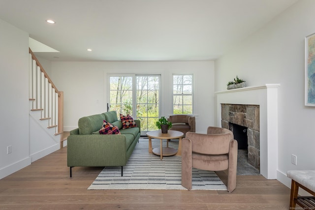 24 Tompkins Hill Rd, Washington, CT 06793 - living area with wood finished floors, stairs, a fireplace, recessed lighting, and baseboards
