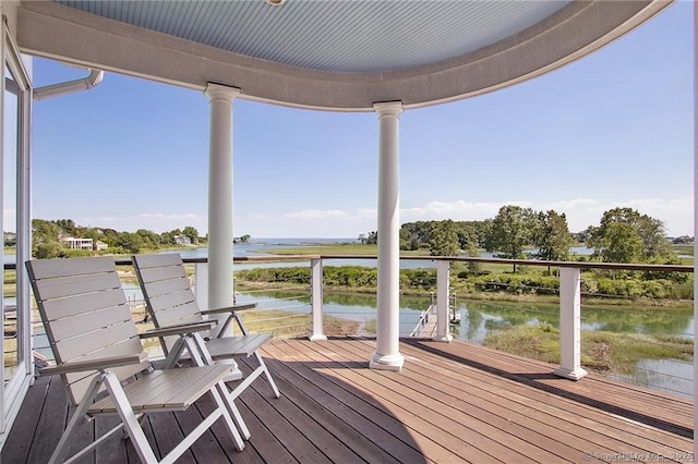 deck featuring a water view