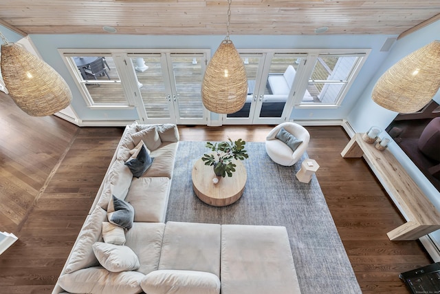 interior space featuring french doors, a skylight, wood ceiling, and wood finished floors