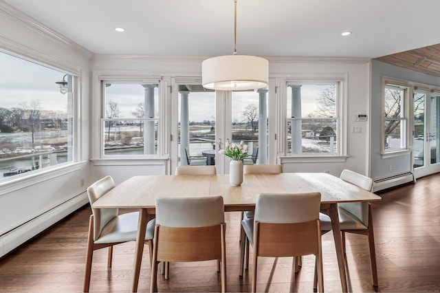 dining room featuring crown molding, a baseboard radiator, wood finished floors, and recessed lighting
