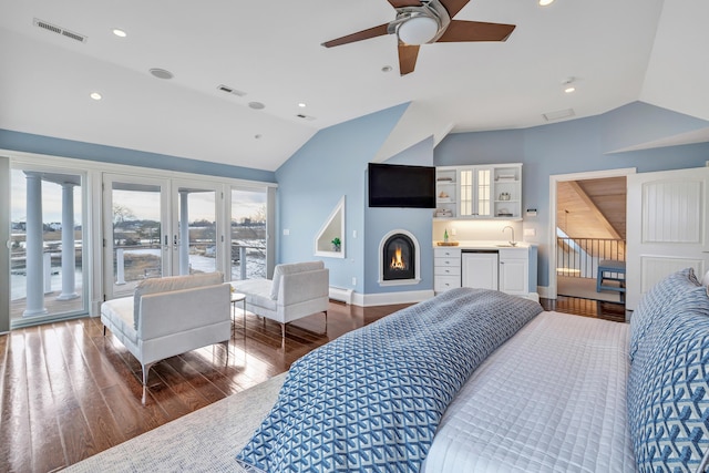 bedroom featuring access to exterior, vaulted ceiling, and visible vents