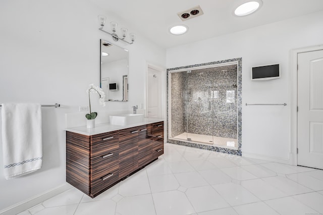 bathroom featuring vanity, baseboards, and a shower stall