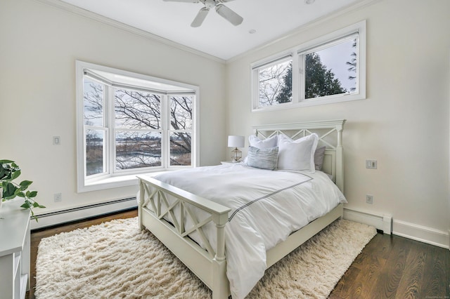 bedroom featuring crown molding, baseboard heating, dark wood finished floors, baseboards, and a baseboard radiator