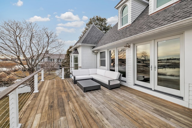 wooden deck with french doors and an outdoor hangout area