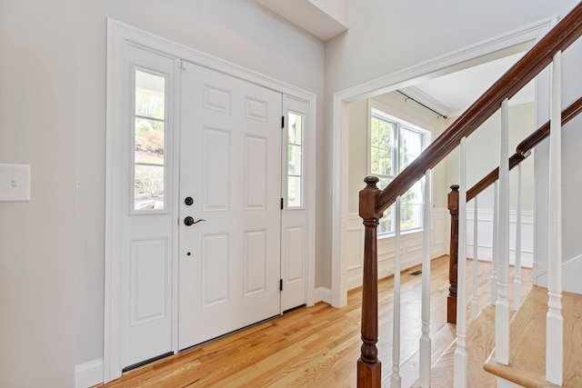 entryway featuring light wood-style flooring and stairway