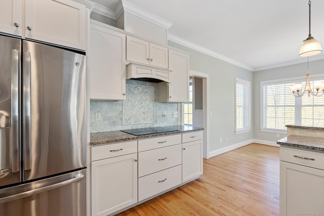 kitchen featuring stainless steel refrigerator, white cabinets, light wood finished floors, black electric stovetop, and custom range hood