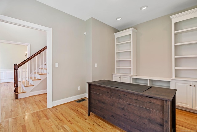unfurnished office with baseboards, recessed lighting, light wood-style flooring, and visible vents