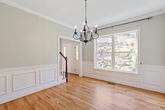 5 Shire Way, Burlington, CT 06013 - unfurnished dining area with a notable chandelier, wainscoting, ornamental molding, and visible vents
