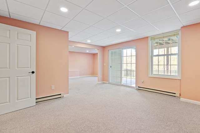spare room with recessed lighting, a baseboard radiator, and carpet flooring