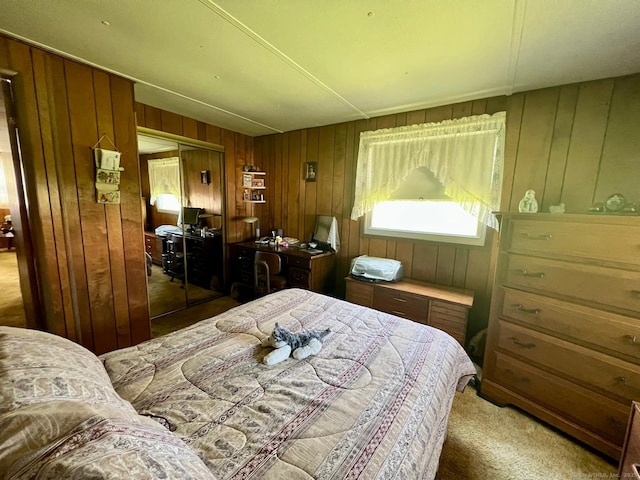 bedroom featuring carpet flooring, wooden walls, and a closet