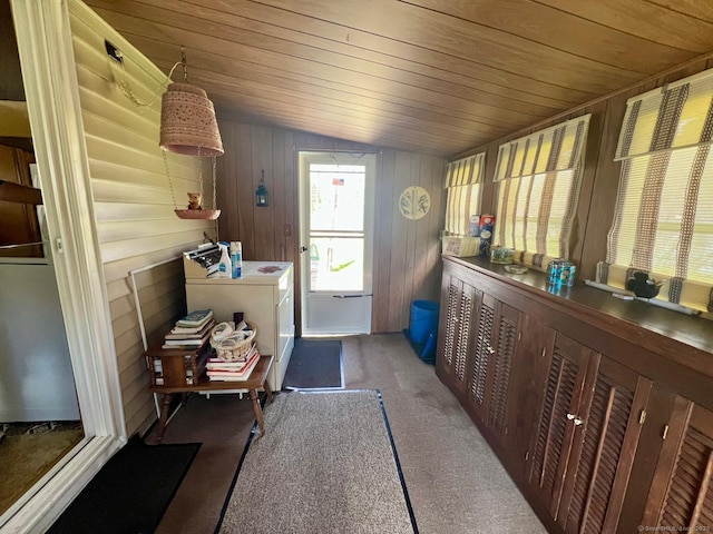 washroom featuring wood ceiling, laundry area, carpet floors, and washing machine and clothes dryer