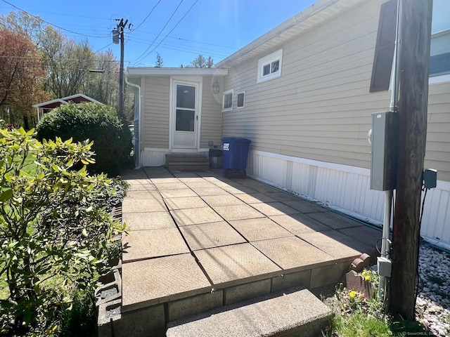 back of property featuring a patio and entry steps