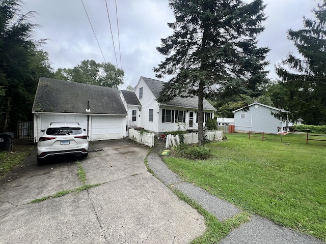 87 Gallivan Ln, Montville, CT 06382 - view of front of house with driveway, roof with shingles, a front yard, fence private yard, and a garage